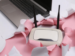Wi-Fi router and laptop on the table